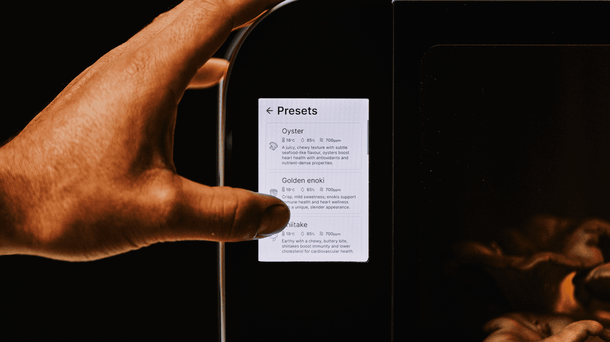 A fingertip selecting a mushroom variety preset on the Flush touch panel
