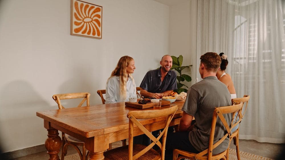 A family sharing dinner made with home-grown mushrooms